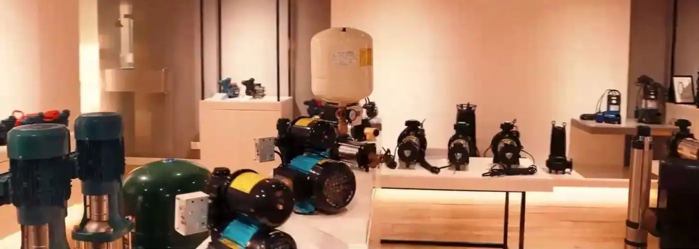 Dharani Pumps and Motors showroom displaying industrial water pumps, pressure booster systems, and pumping equipment in Coimbatore